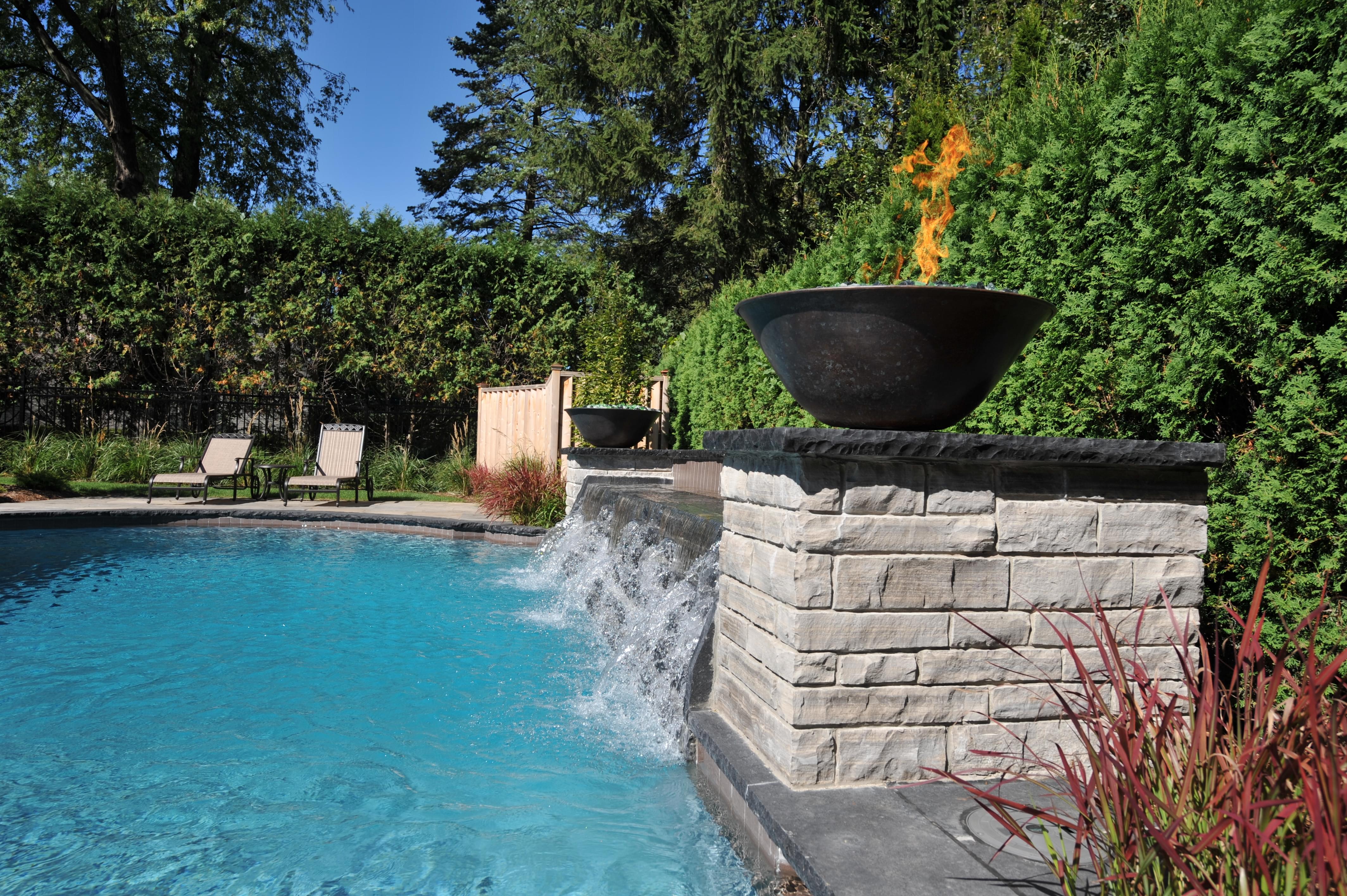 Image of swimming pool, waterfall and fire feature