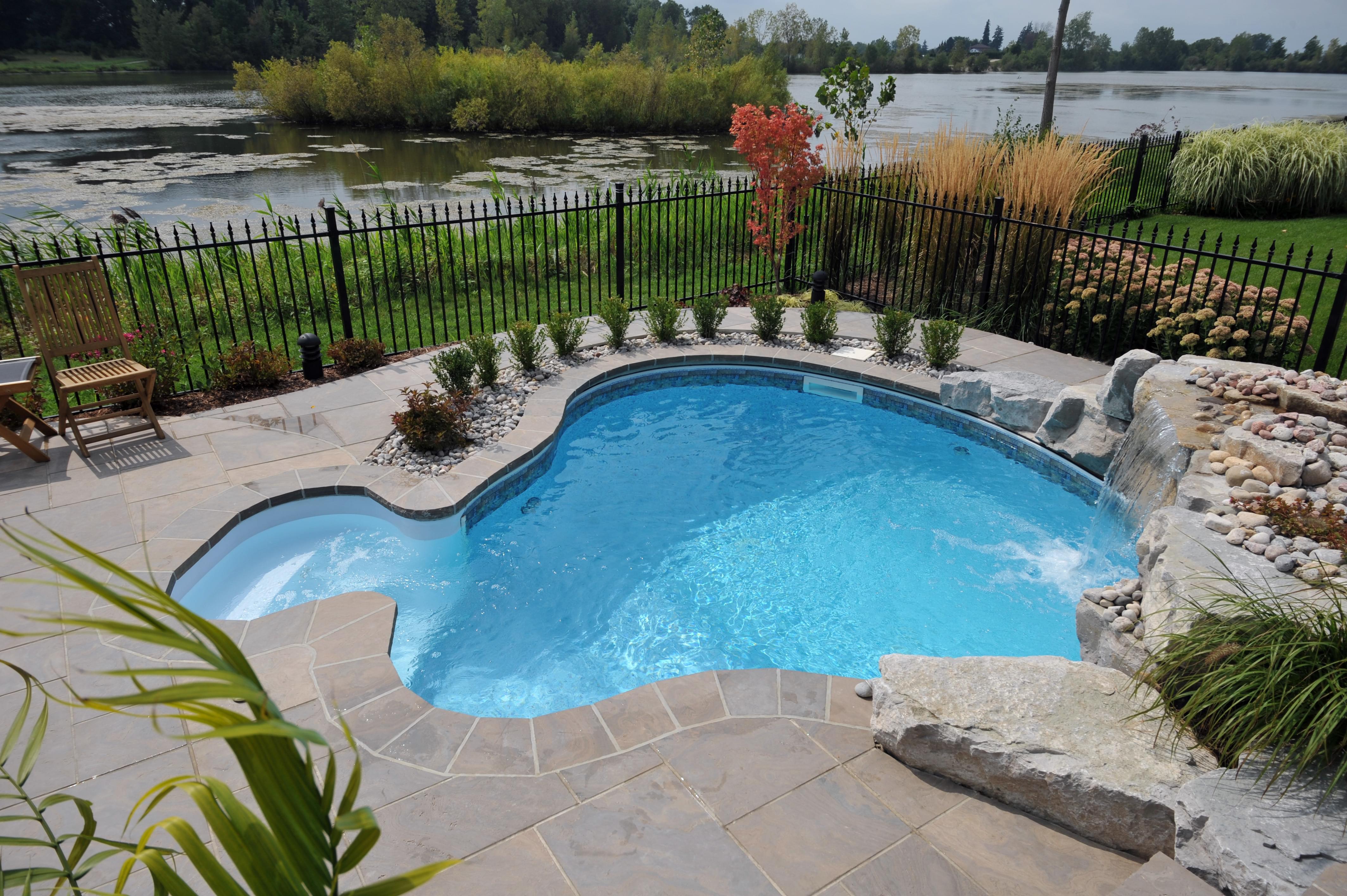 Image of outdoor swimming pool with waterfall